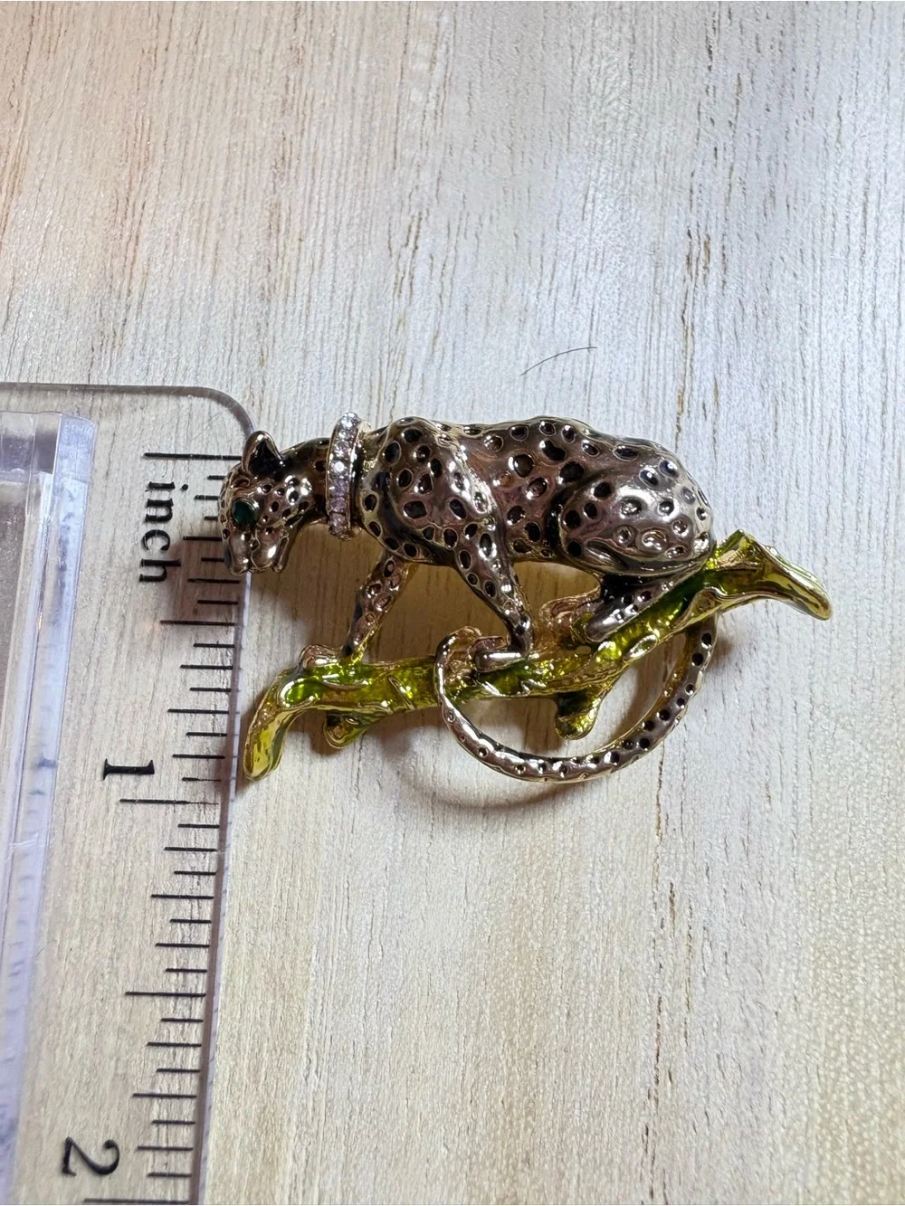 Gold-Tone Leopard Brooch with Green Accent on Branch